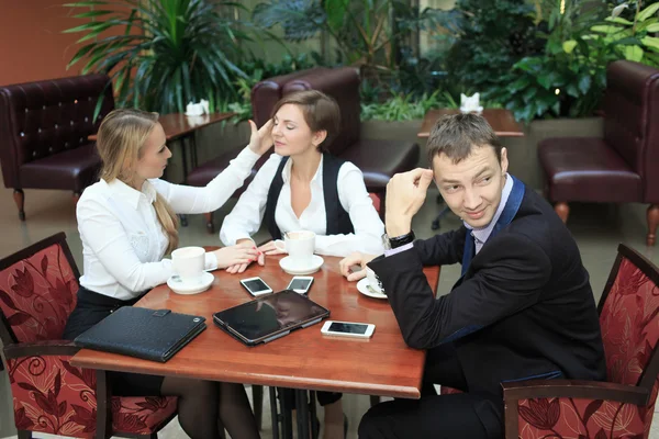 Lesbian girls at the business lunch. man confused. flirt — Stock Photo, Image