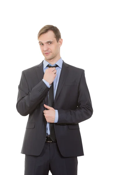 Lenguaje corporal. hombre en traje de negocios aislado sobre fondo blanco. endereza su corbata, coqueteando — Foto de Stock