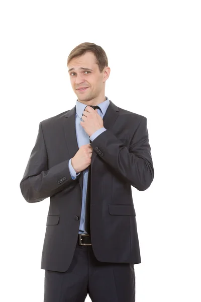 Řeč těla. muž v podnikání jak izolovaných na bílém pozadí. narovnává kravatu, flirtování — Stock fotografie