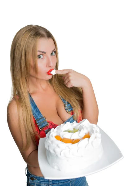 Busty sexy girl eating cake with whipped cream — Stock Photo, Image