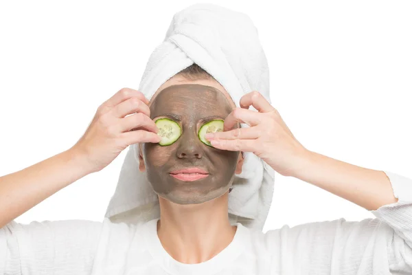 Young beautiful woman in mask for the face. therapeutic black clay. Spa treatment. — Stock Photo, Image