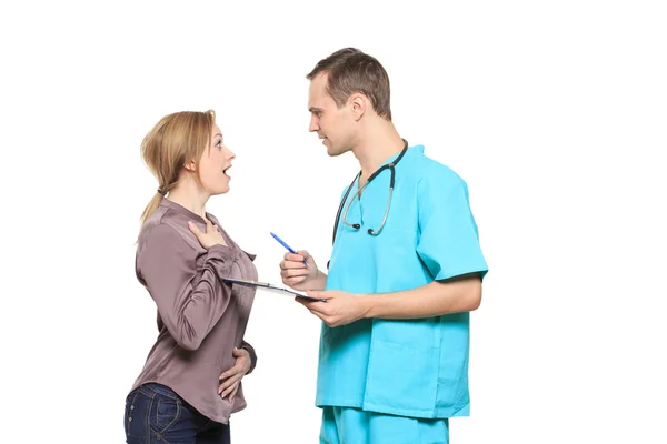 Male doctor interrogates a happy woman patient. Isolated white background — Stock Photo, Image