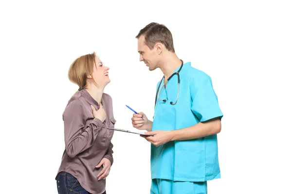 Male doctor interrogates a happy woman patient. Isolated white background — Stock Photo, Image