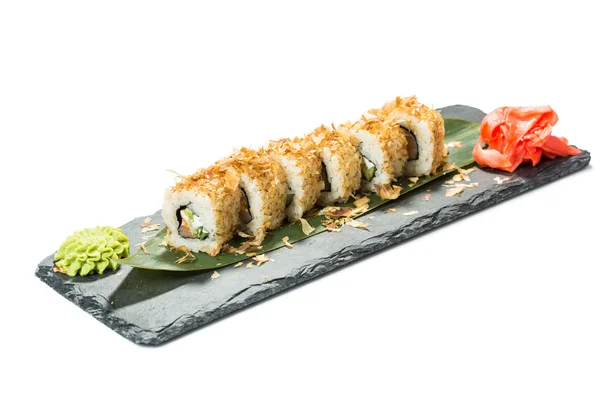 Set sushi op zwarte leisteen substraat, geïsoleerde witte achtergrond — Stockfoto