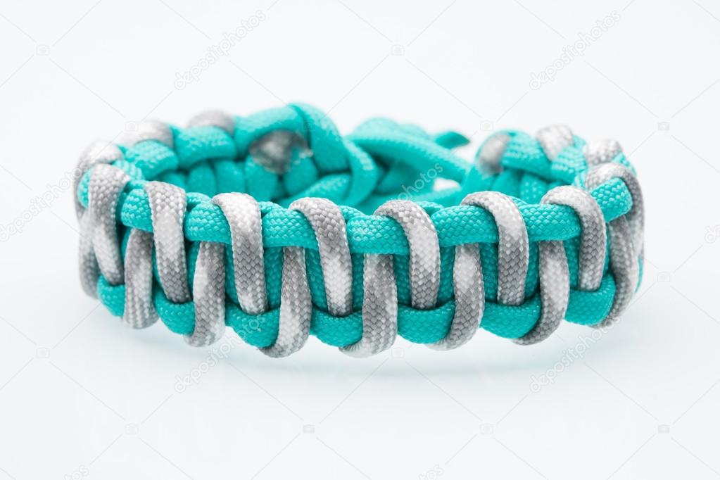 Black braided bracelet on white background
