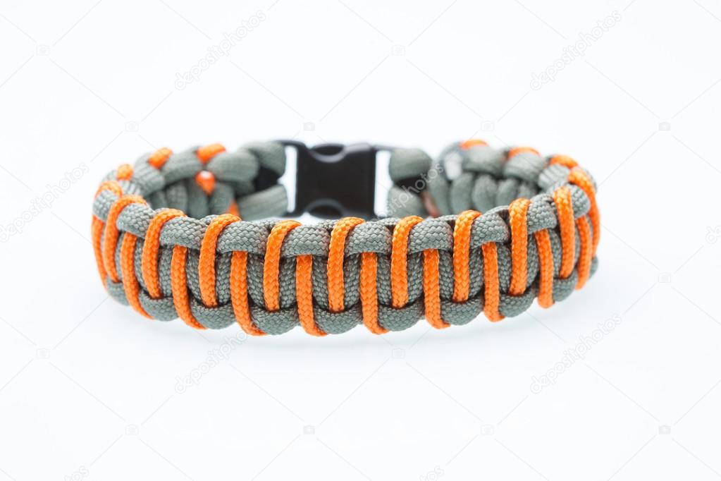 Black braided bracelet on white background
