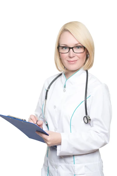 Smiling medical doctor in glasses woman with stethoscope. Isolated over white background — Stok fotoğraf