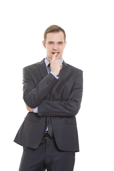 Linguaggio del corpo. uomo vestito abito da lavoro isolato su sfondo bianco. un dito in bocca. un gesto di incertezza, bisogno di approvazione e sostegno — Foto Stock