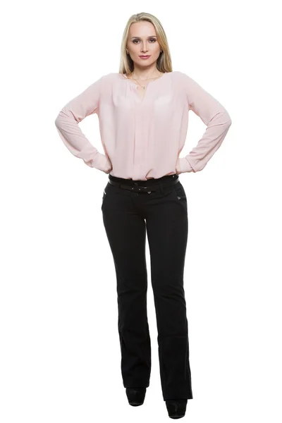 Girl in pants and blous.  Isolated on white background. body language. legs wide apart, hands on hips. call, ready to go. fists, aggression — Zdjęcie stockowe