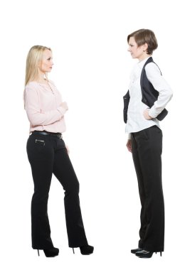 two businesswomen, isolated on white background. body language, gestures psychology. paired gestures. conflict situation. aggressive posture ready. negativity