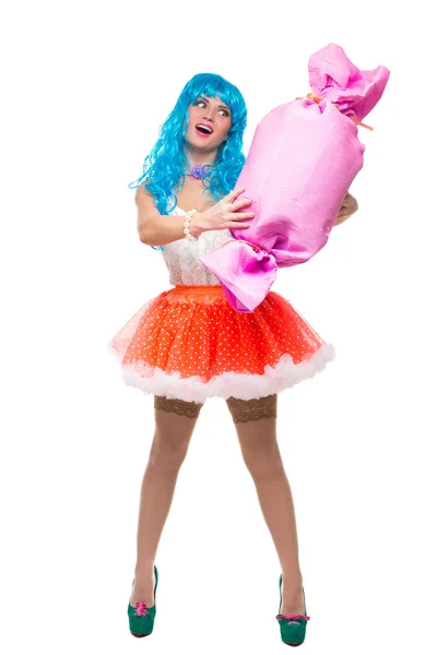 Sexy girl doll with blue hair. huge candy in the hands. confectionery. — Stock Photo, Image