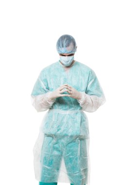Surgeon portrait. isolated on white background. focuses on reflection. fingers pyramid. praying