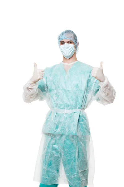 Surgeon portrait. isolated on white background. He raised thumbs. satisfied — ストック写真