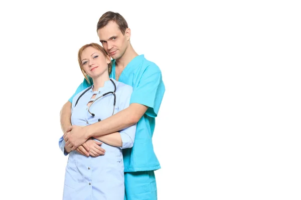 A male and a female doctor kissing at work. love affair at work. isolated on white background — Φωτογραφία Αρχείου