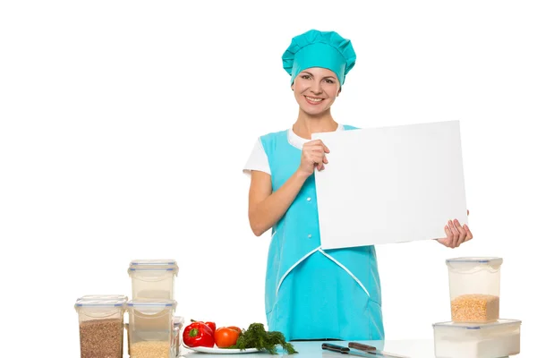 Attractive girl chef with a white plate. Isolated. vvery happy — Stock fotografie