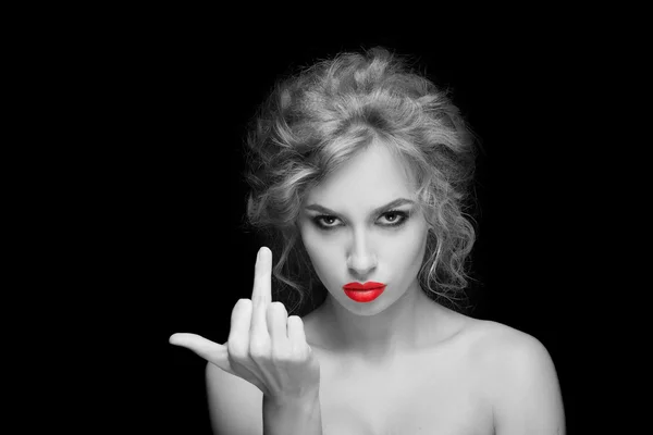 Stylish fashion blonde girl showing middle finger. isolated on a black background — Stok fotoğraf