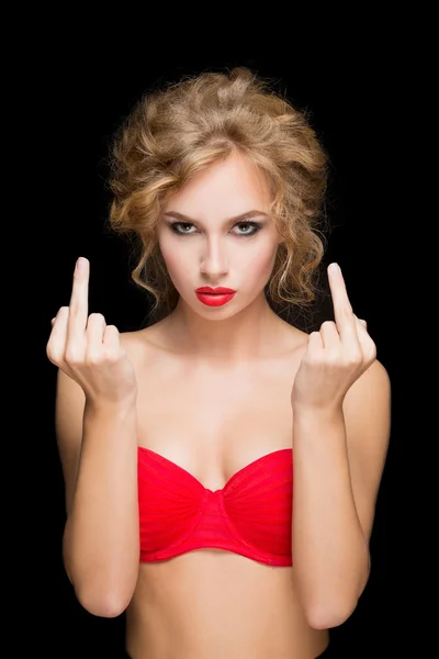 Stylish fashion blonde girl showing middle finger. isolated on a black background — Stock fotografie