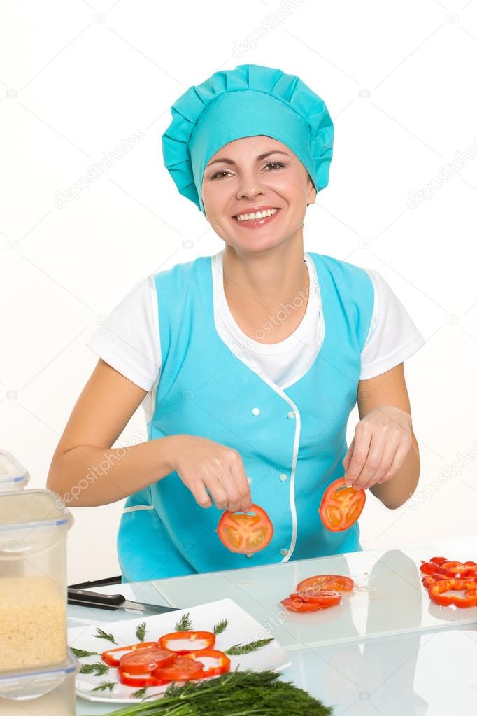 cooking and food concept - smiling female chef, cook or baker chopping vegetables. Isolated on white background