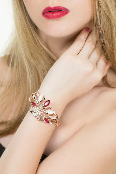 Beautiful young blond woman in multiple bracelets — Stock Photo, Image