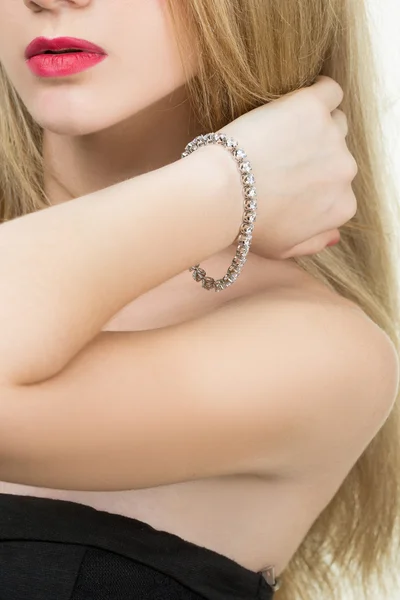 Beautiful young blond woman in multiple bracelets — Stock Photo, Image