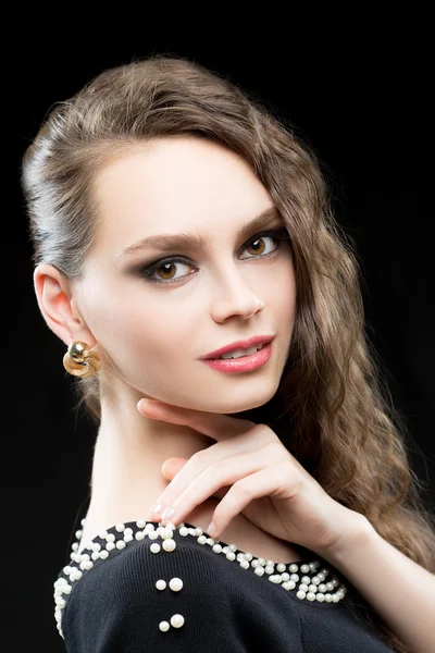 Portrait of beautiful brunette woman in black dress. — Stock Photo, Image