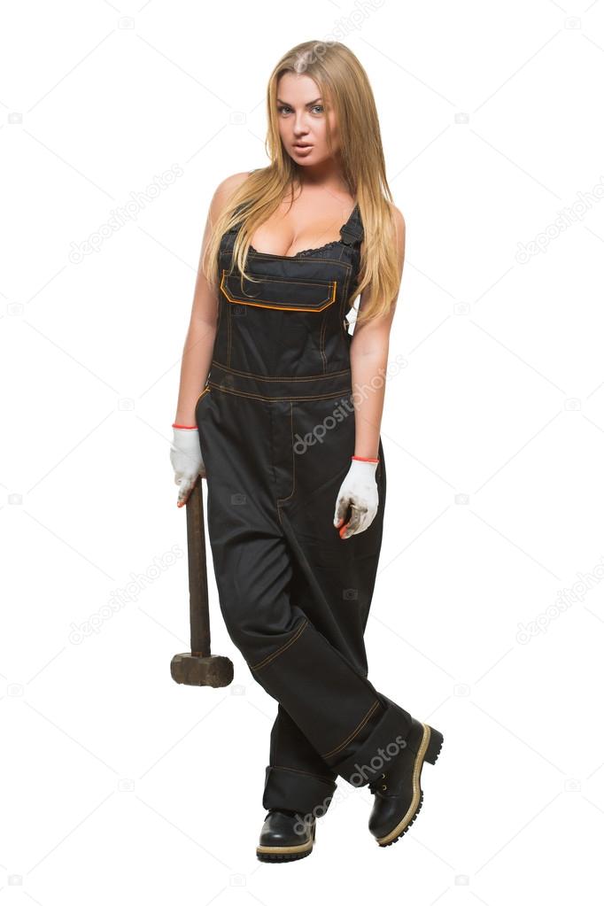 Busty sexy girl with a hammer in his hand.