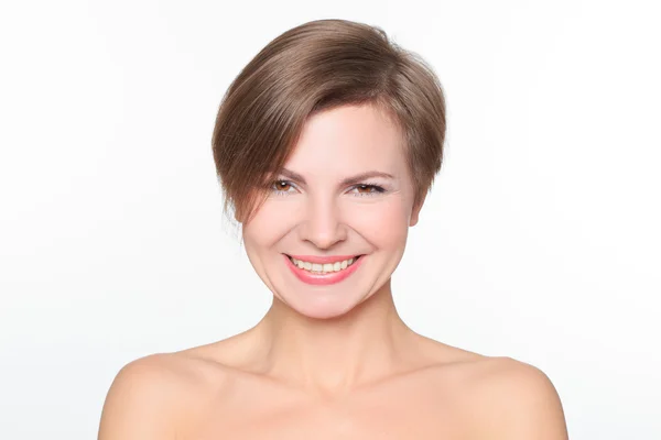 Portrait of a beautiful woman with bare shoulders and short hair. wryly. — Stock Photo, Image