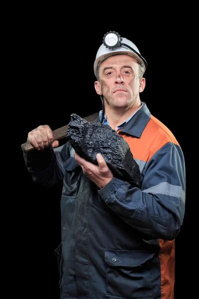 Minero de carbón sostiene un gran pedazo de carbón rico en energía — Foto de Stock