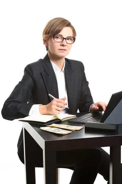 Girl plans to budget. Dollar said. She is counting money at the table — Stock Photo, Image