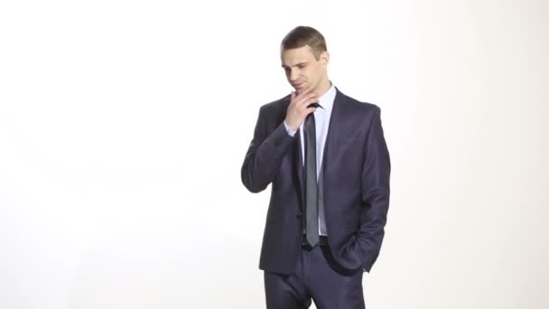 Gestures distrust lies. body language. man in business suit isolated on white background. finger touching the chin. cards — Stock Video