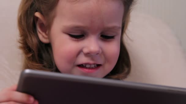 Little girl with tablet computer closeup — Stock Video