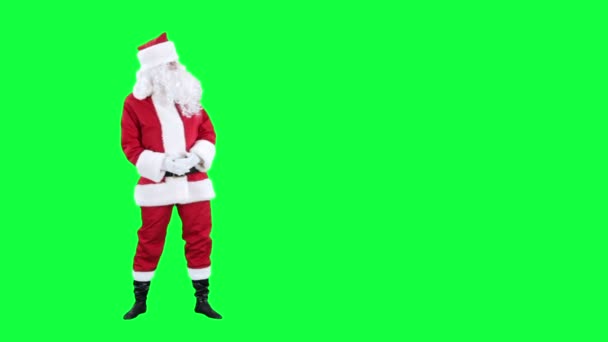 Santa Claus mira algo croma clave (pantalla verde ) — Vídeo de stock