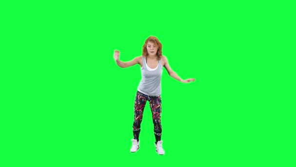 Dancing woman isolated on green — Stock Video