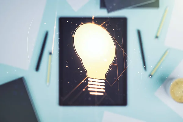 Creative light bulb illustration and modern digital tablet on desktop on background, top view, future technology concept. Multiexposure