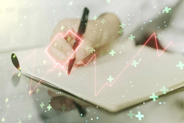 Dubbele blootstelling van creatieve abstracte hartslag hologram en man handschrift in notebook op de achtergrond. Technologisch concept van de gezondheidszorg — Stockfoto