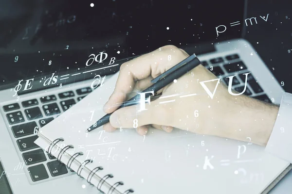 Креативная научная формула highgram с рукописным написанием в блокноте на фоне ноутбука, исследовательская концепция. Мультиэкспозиция — стоковое фото