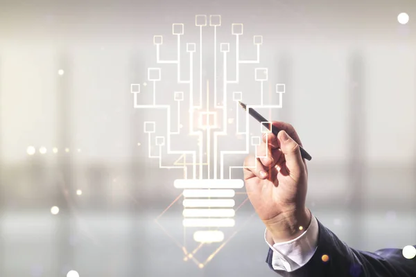Developers hand with pen draws virtual creative light bulb illustration with microcircuit on blurred office background, future technology concept. Multiexposure