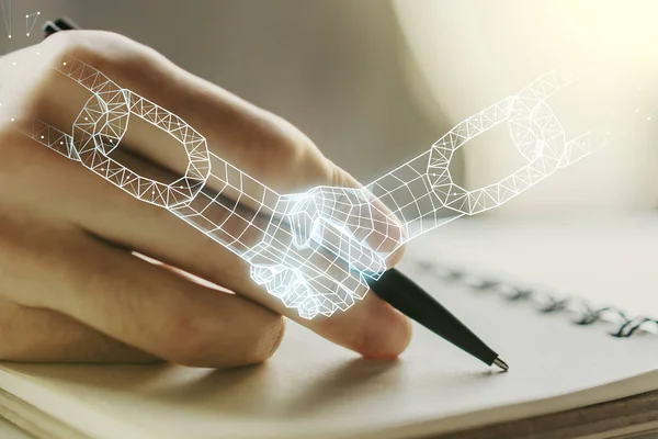 Creative abstract block chain technology sketch with handshake and man hand writing in notepad on background, future technology and blockchain concept. Double exposure