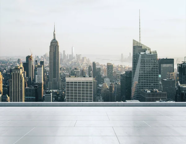 Empty concrete rooftop on the background of a beautiful New York city skyline at sunset, mock up