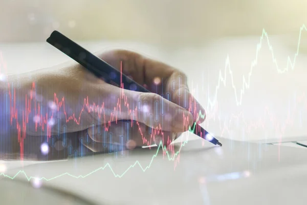 Multi exposição de gráfico financeiro abstrato com a mão escrita em notebook em segundo plano, conceito financeiro e de negociação — Fotografia de Stock