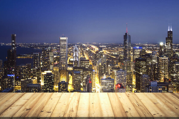 Wooden tabletop with beautiful Chicago skyscrapers at evening on background, mock up