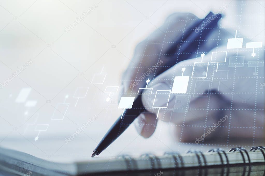 Multi exposure of abstract financial graph with hand writing in notebook on background, financial and trading concept