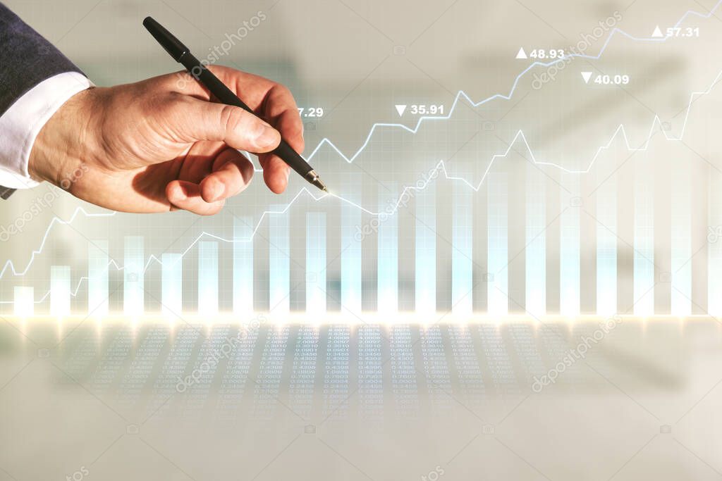 Double exposure of man hand with pen working with virtual creative financial diagram on blurred office background, banking and accounting concept