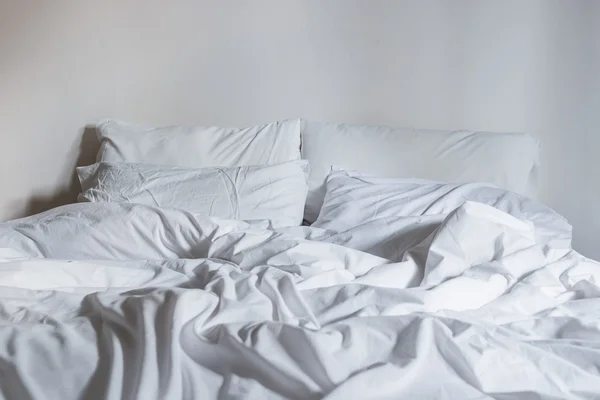 White bedding sheets and pillow, Messy bed concept