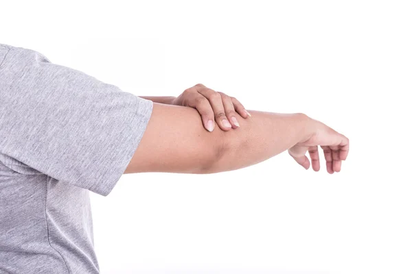 Cerca de la mano de la mujer sosteniendo su codo aislado en blanco. Codo — Foto de Stock