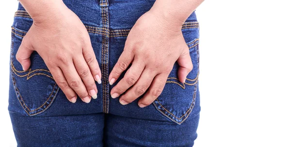 Gros plan main de femme tenant le dos : hémorroïdes Concept — Photo