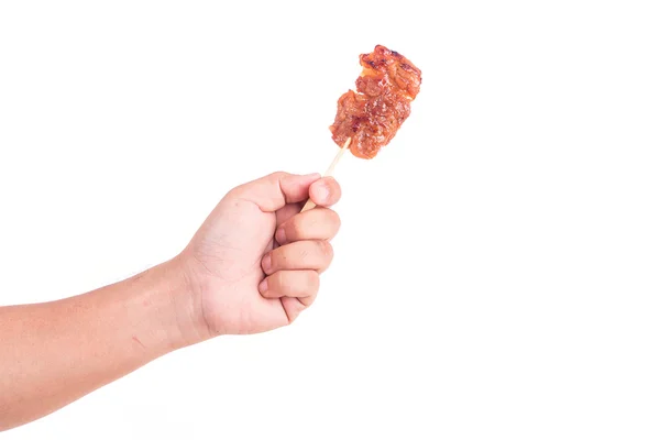 Hand holding grilled pork in bamboo stick isolate on white — Stock Photo, Image