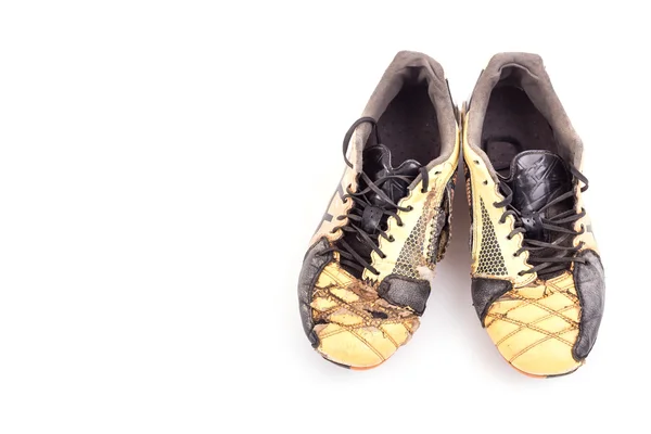 Zapatos de fútbol viejos aislados en blanco —  Fotos de Stock
