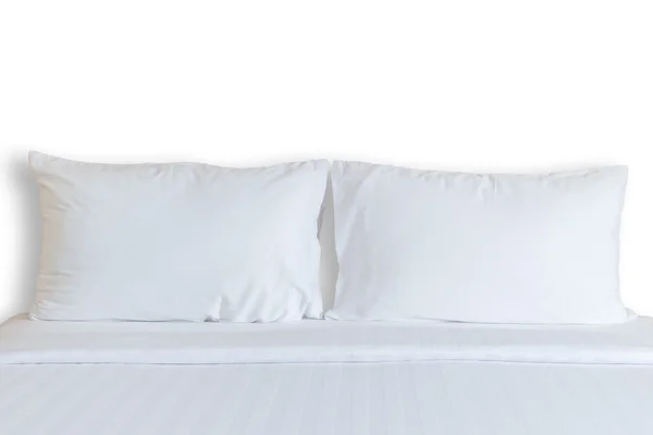 White bedding sheets and pillow in hotel room