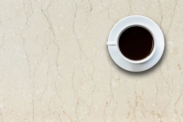 Weiße Kaffeetasse auf Stein Tisch Hintergrund Ansicht von oben — Stockfoto